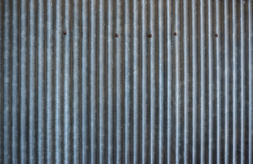 Rusty corrugated metal texture. Old zinc sheet.