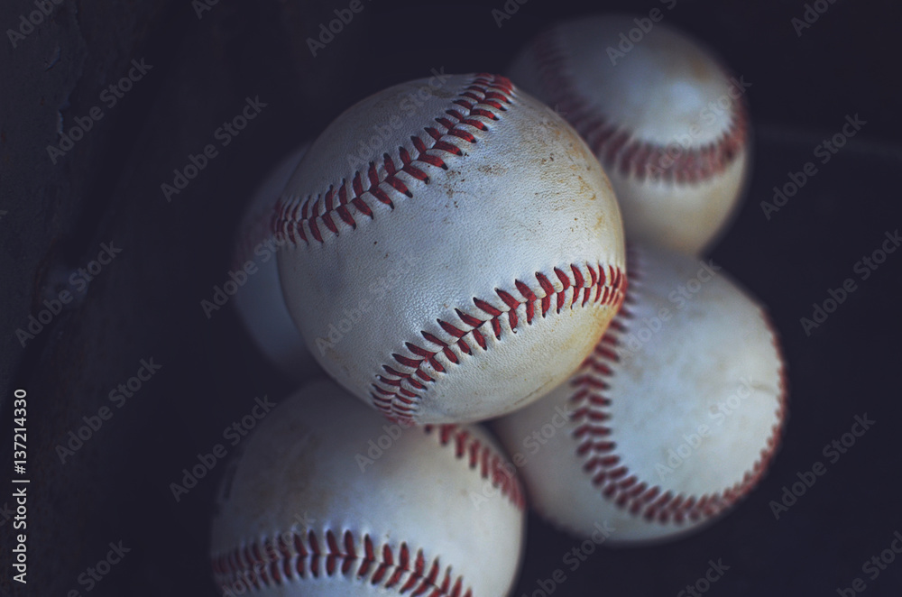 Sticker Old baseballs in a pile, perfect for sports or athletic background. - Stickers