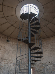 Iron spiral stairs in old tower