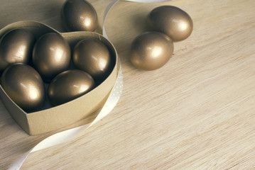 gold eggs in heart box