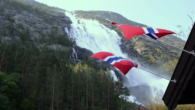 Two views of picturesque waterfall Langfoss in Norway with Norwegian flags on foreground. National tourist route