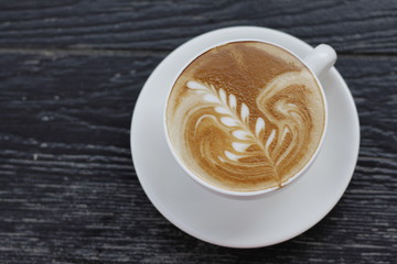 Coffee cup on the table, latte art