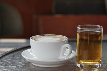 Coffee cup on the table, latte art