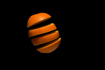 Orange, fruit levitation on black background