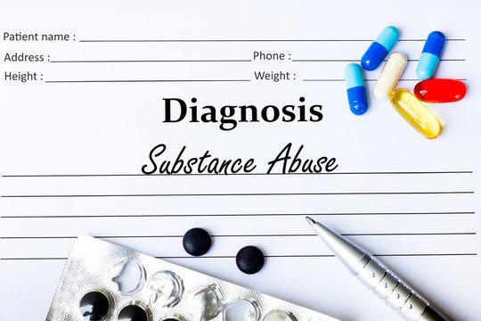 Substance Abuse - Diagnosis Written On A Piece Of White Paper With Medication And Pills