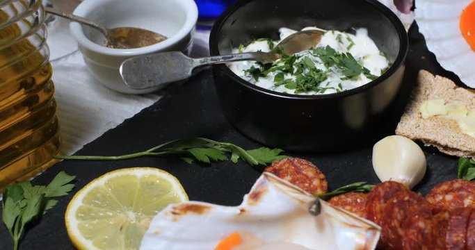 Dolly close up push out view of ingredients for scallops with chorizo in garlic mayonnaise