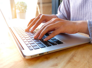 Woman office worker is typing keyboard