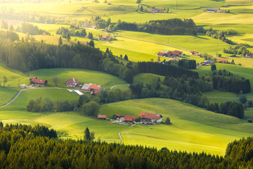 Lovely rural countryside in beautiful sunlight. Pasture landscape with barnyards.