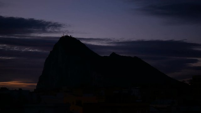Dawn time-lapse of Gibraltar Rock and La Linea de la Concepcion cityscape in Spain.