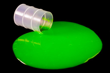 Green slime spills out of barrel