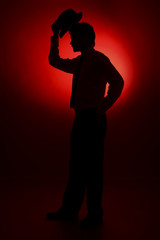 The silhouette of the bride and groom on a red background