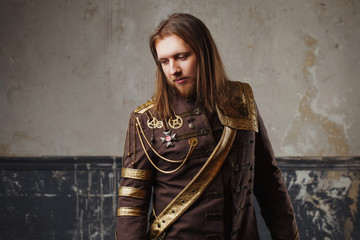Fototapeta premium Handsome male Steam punk. Retro man in uniform, portrait over grunge background.