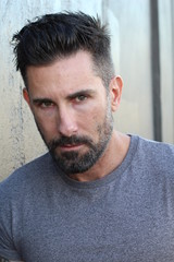 Obraz premium Handsome man with neutral expression closeup