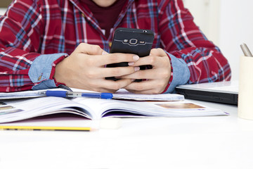 closeup child with the cellphone at school