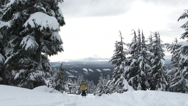 One skier passes by, traveling downhill at Mt Hood Timberline in Oregon after fresh snowfall.