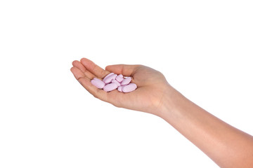 Medical pills on open hand isolated
