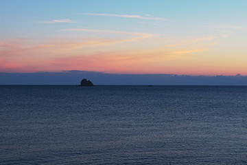 Rock sticking out of the sea. Tyrrhenian Sea. Marina di Patti. Sicily