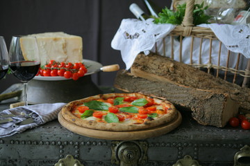 Neapolitan pizza with mozzarella, cherry tomato and fresh basil