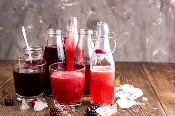 Bottle with fresh homemade berry lemonade with pulp