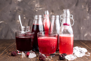 Bottle with fresh homemade berry lemonade with pulp