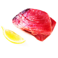 Raw tuna steak isolated on white background.