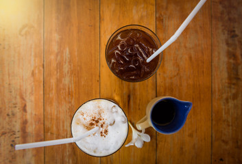 Glass Of Cold Coffee On Wooden table