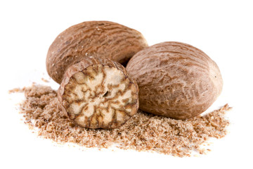 Three nutmeg and powder isolated on white background