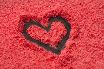 Heart on color sand