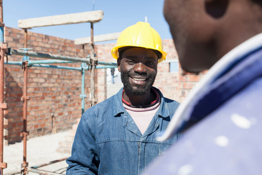 Builders talking on construction site