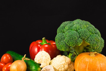 Various vegetables on the black background. Copy space