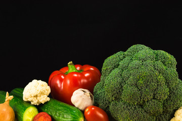 Various vegetables on the black background. Copy space