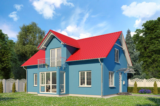 Ein blaues Einfamilienhaus in blühender Natur im Sommer am Tag.