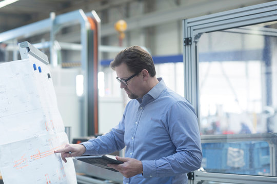 Engineer working in industrial plant