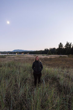 Portrait of woman in marshland, Rathrevor Beach Provincial Park, Vancouver Island, British Columbia, Canada