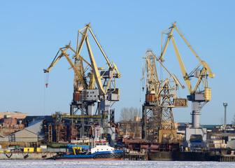 Fototapeta na wymiar Loading Cranes at the port.