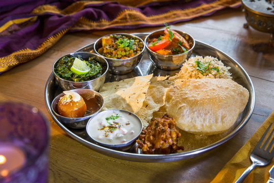 Indian cuisine, Thali bowls on restaurant table