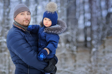 Fototapeta na wymiar Little boy with father outdoor. Winter. .