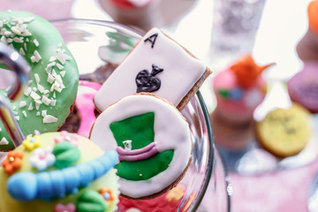 portrait of birthday party supplies. sweet corner with cake, lollies, cookies and candy