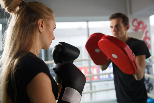 Young couple trains in boxing