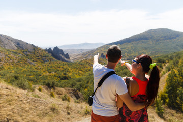 Fototapeta na wymiar Family admires beautiful mountain landscape