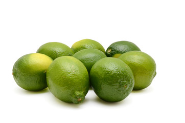 Fresh limes isolated on white background