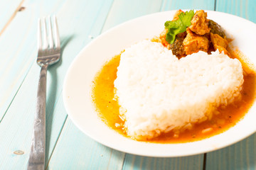 lunch, rice on the plate on a wooden background
