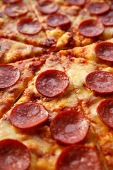 Pepperoni pizza. Hot homemade food. Sliced fresh italian classic salami pizza. Popular topping with cheese. Baked meal.