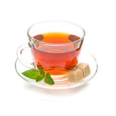 Isolated cup of black tea with mint leaves and sugar