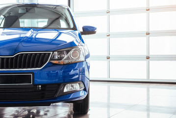 The headlights and hood Blue sports car.