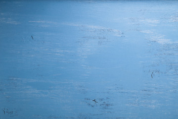 Blue wood background. Painted scraped wooden board. Grunge plywood texture or pattern.