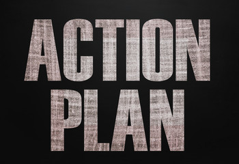 Black chalk board with the text Action plan