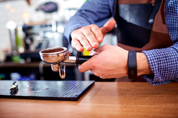 Fototapeta na wymiar Hands bartender baristas make coffee cocoa cappuccino.