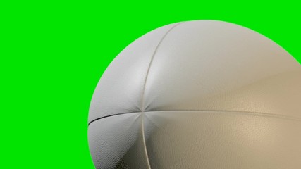 A closeup of a traditional rugby ball with a textured surface rotating once to create a loop able sequence on a green screen background - 3D render