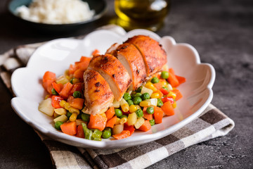 Roasted chicken breasts with rice and steamed vegetable salad